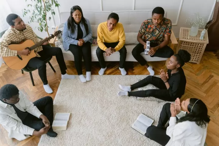 A small circle of women and men in a faith-based support group